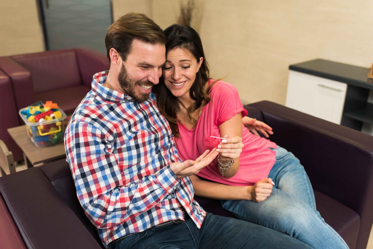Couple looking at pregnancy test result